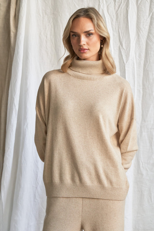 Indulge in the soft luxury of our oversized oatmeal cashmere sweater, designed with a high neckline and relaxed fit for all-day comfort. Made from 100% pure, ethically sourced cashmere, this roomy women’s knit features wide sleeves, drop shoulders, and a soft neutral hue that complements every wardrobe.
Perfect for layering or lounging, this high neck oversized sweater is a modern essential for effortless cold-weather dressing. Soft, breathable, and naturally insulating — it’s winter comfort with elevated
