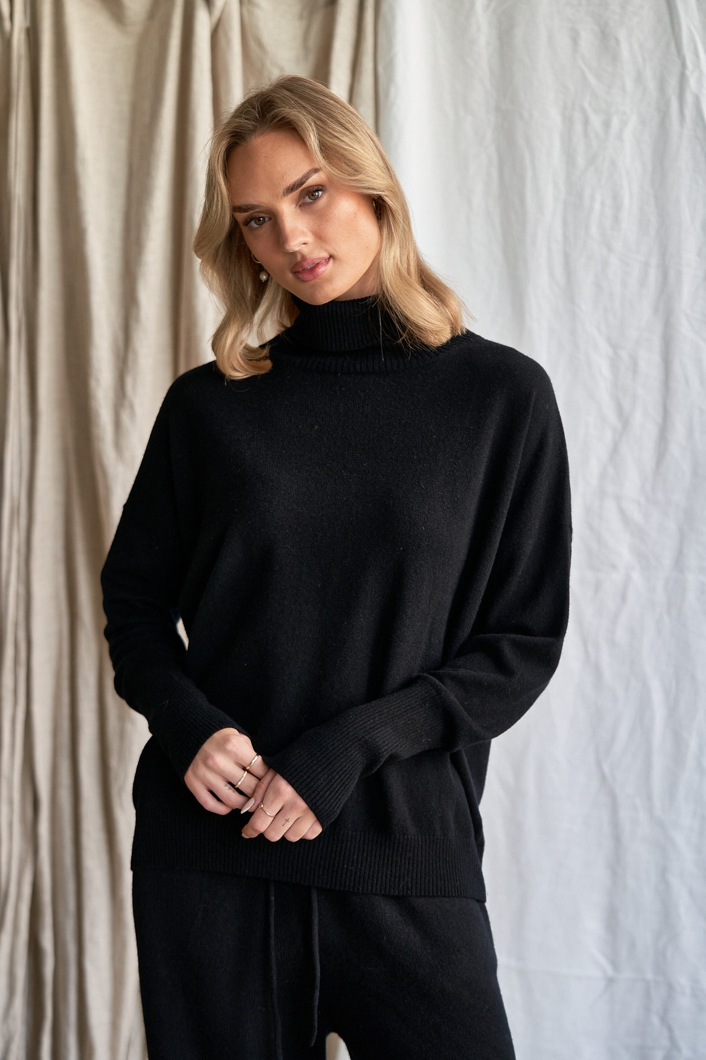 Black Oversized Cashmere Sweater – Women’s High Neck Knit | 100% Pure Cashmere

Experience timeless sophistication with our oversized black cashmere sweater, crafted from 100% ethically sourced pure cashmere. This women’s high neck sweater features an elegant oversized fit, dropped shoulders, and ribbed detailing for a chic yet cozy silhouette.

A true classic in deep black, this luxurious knit pairs effortlessly with anything in your wardrobe — from denim to silk. Perfect for layering or wearing solo