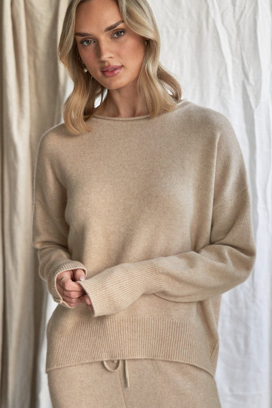 Oatmeal Cashmere Sweater with Rolled Edges – Women’s Relaxed Fit | 100% Pure Cashmere

Add quiet elegance to your wardrobe with our oatmeal cashmere sweater, crafted from 100% pure, ethically sourced cashmere and finished with soft rolled edges for a naturally relaxed look. This women’s cashmere knit features a slightly boxy silhouette, a cozy feel, and a versatile neutral tone that styles effortlessly from season to season.

Lightweight yet insulating, this timeless sweater is perfect for layering or weari